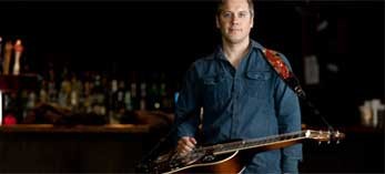 man with lap guitar